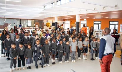 AKA Maputo student works on an art project inside a classroom.