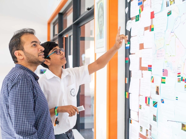 An AKA Maputo teacher and student working together inside a classroom.