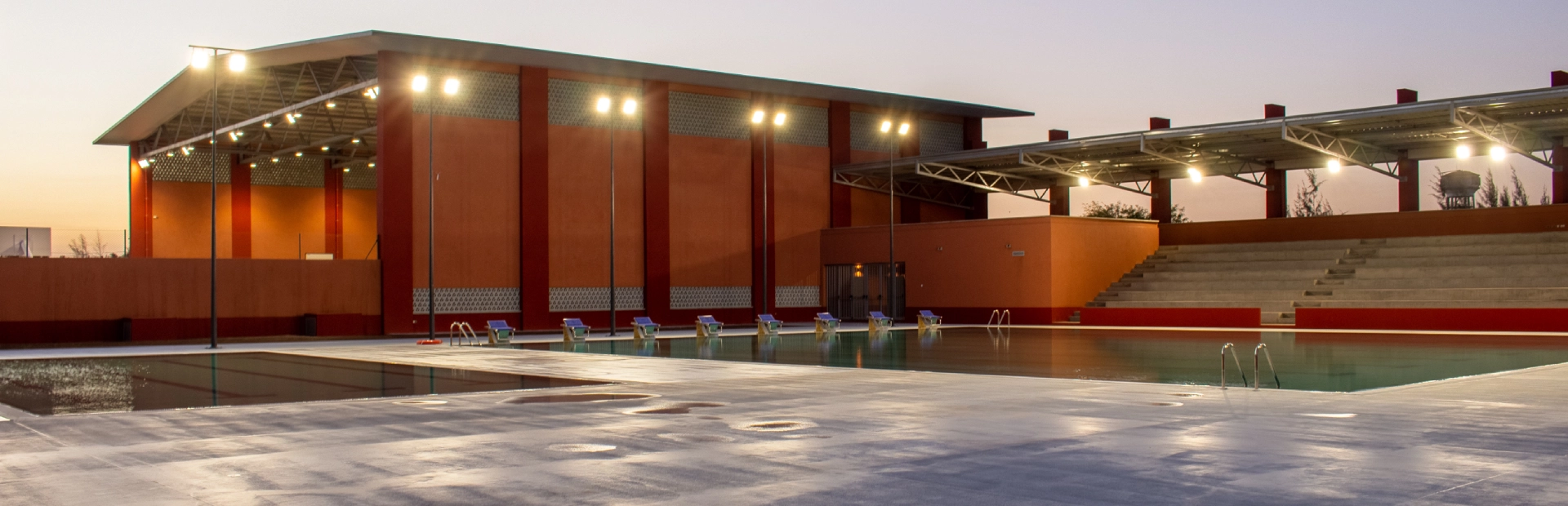 Students and a teacher conduct a science experiment using lab equipment in a classroom.