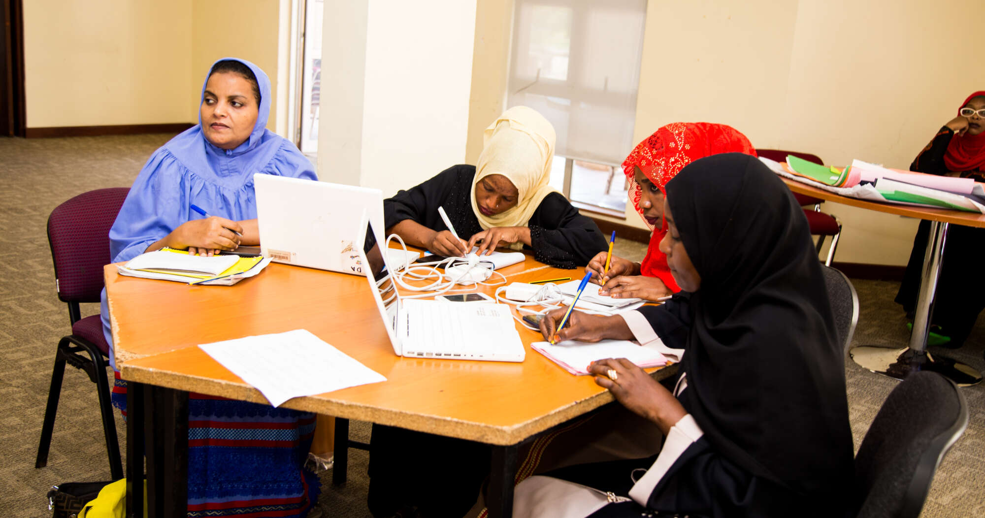 Three teachers participating in a session at the AKA Mombasa PDC