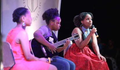 Student swimming competitively.