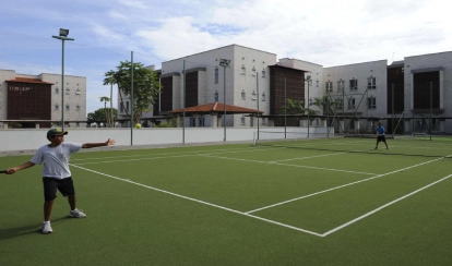 Students playing tennis.