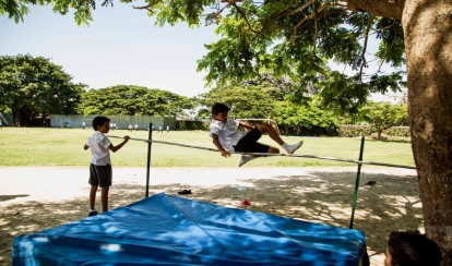 A student practises the high jump.