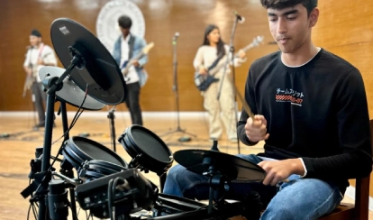 Students learn how to play different musical instruments and perform them on stage in events.