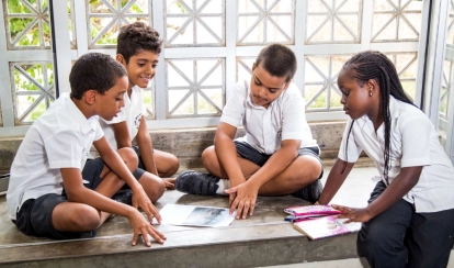 Junior School students working on a balcony.
