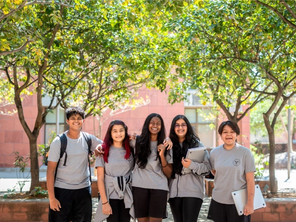 DP students looking at the camera, smiling.