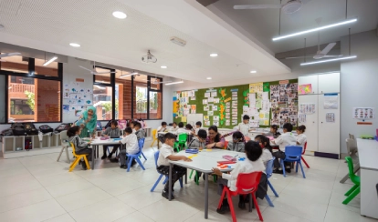 Students and teachers sitting in a classroom.
