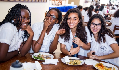 A group of girls having lunch together.