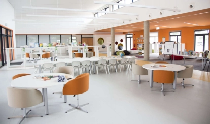  Students paint with brushes in a school art classroom.