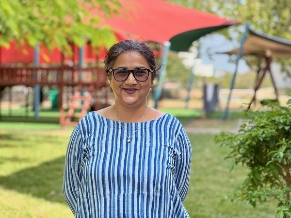  Junior School teacher standing in the playground