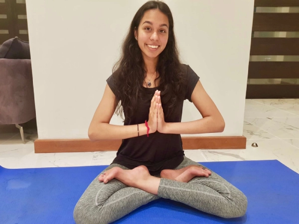 Navika Lodhia doing a yoga pose.