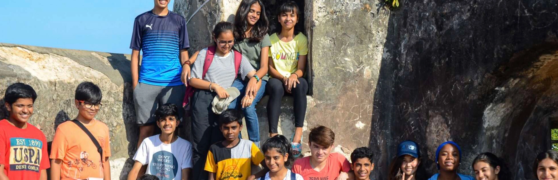 Students standing outside at a fort.