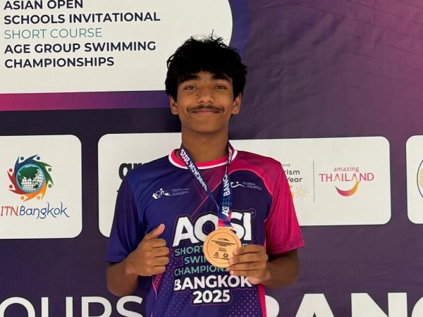 Aditya with his medal.