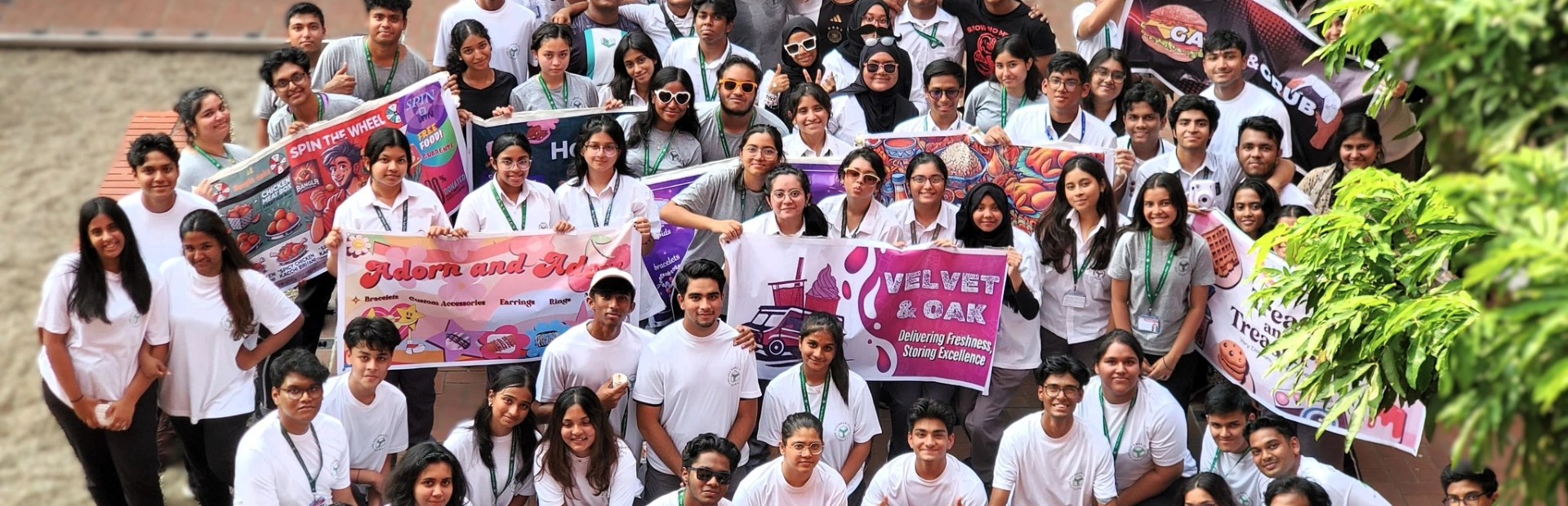 A large group of Senior School students posing together in an open courtyard.