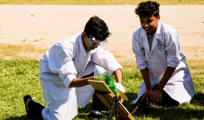  Diploma Programme students conducting an experiment.