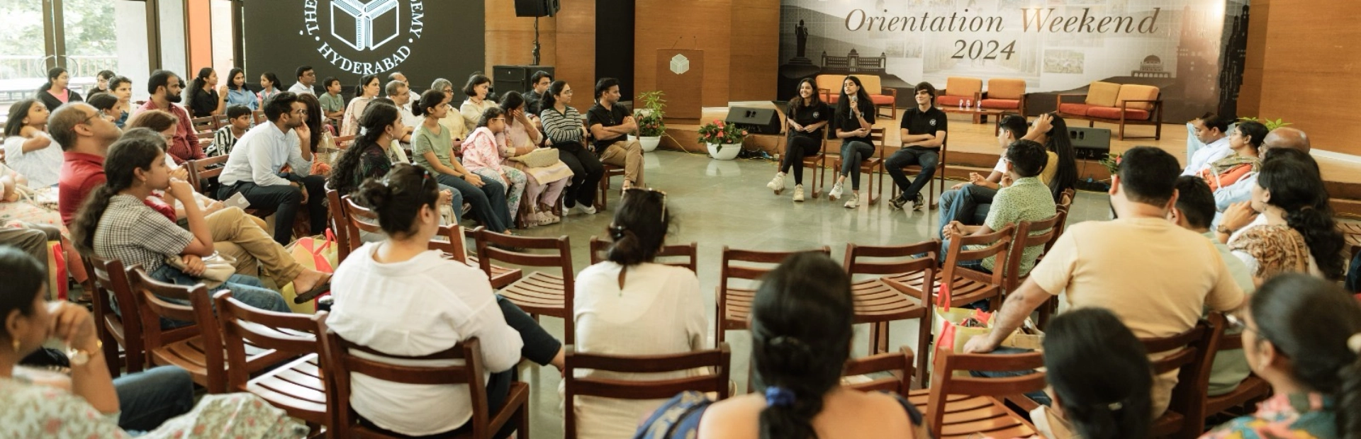  Parents sitting during an orientation at the Academy. 