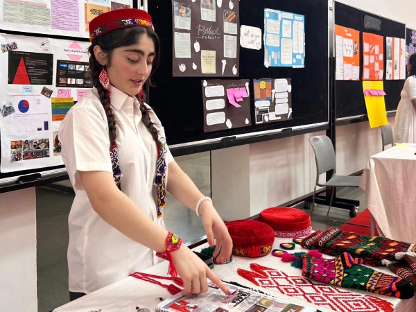 Faatiha stands at a podium, delivering a speech at the United Nations, where she is advocating for child rights and climate action