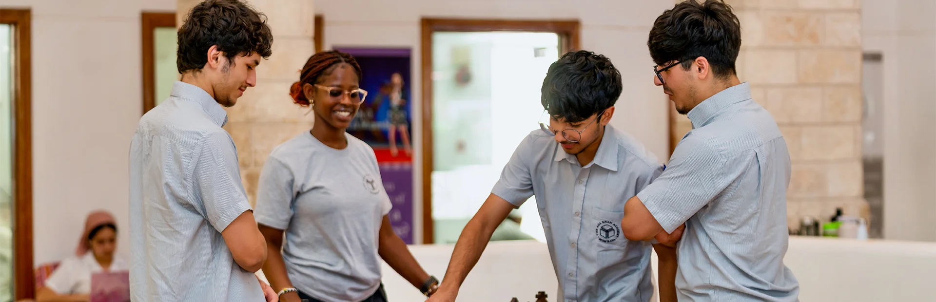 Diploma Programme students playing chess in the library.