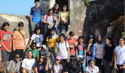  Students paint with brushes in a school art classroom.