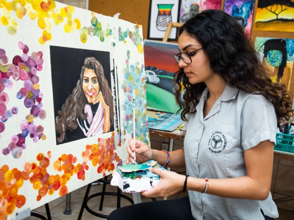 Student painting in an art room.
